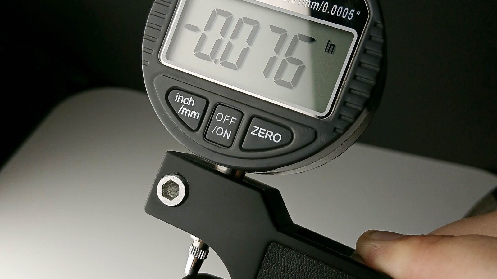 Digital micrometer measuring a machined surface